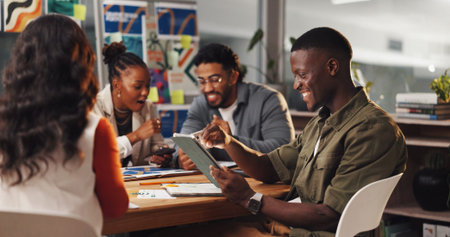 Team, creative and people in office with tablet in meeting for graphic design, planning and project. Digital agency, happy and workers with tech, research and ideas for website, UI and homepage infoの写真素材