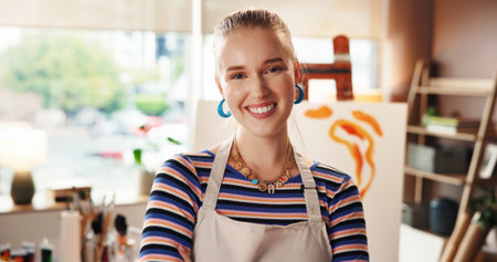 Painter, happy and woman with portrait in home studio for art creation, painting process or talent. Smile, artist and confidence with artwork for creative hobby, self expression or exhibition projectの写真素材