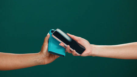 Hands, pos machine and scan phone in studio for electronic transaction, tap payment and purchase....