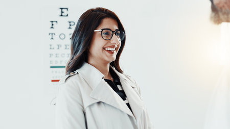 Smile, optometry and glasses with patient and doctor for eye care, results and consulting. Healthcare, ophthalmology and vision with woman in clinic for exam, eyesight and new prescription or frameの写真素材