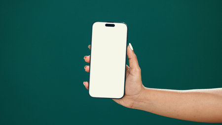 Hands, person and phone screen with mockup in studio for digital marketing, advertising space or UX....