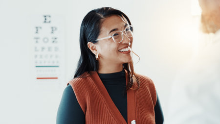 Smile, optometry and glasses with woman and doctor for eye care, results and consulting. Healthcare, ophthalmology and vision with patient in clinic for exam, eyesight and new prescription or frameの写真素材