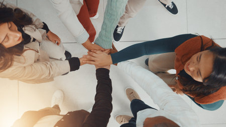 Business people, hands together and above for collaboration, support or teamwork with goals. Employees, group and circle with stack for mission, target and staff synergy for success celebrationの写真素材