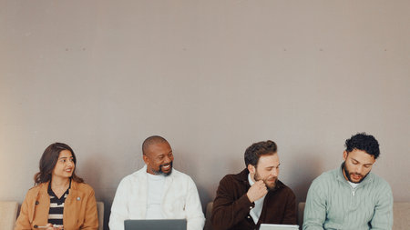 People, tech and happy in queue for interview by wall, mockup space and networking at recruitment agency. Man, group and smile with computer, tablet or talk in row for job opportunity at HR companyの写真素材