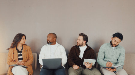 Discussion, recruitment and waiting room with business people for hiring, planning and space. Interview, queue and group of workers with HR conversation, technology and job search for career adviceの写真素材