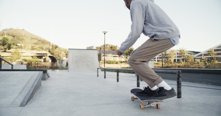 Man, skateboard and ramp in city, fitness and competition with freestyle practice, sports and exercise. Person, skater and talent with stunt, outdoor and workout with training and performing actionの写真素材