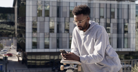 Online, skateboarder and man with smartphone, texting or communication with contact, city or...