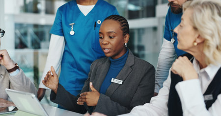 Doctors, nurses or meeting with tablet in hospital for surgery schedule, task delegation or...