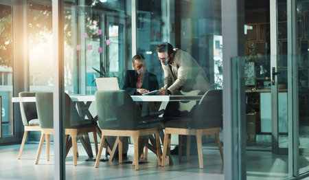 Training, business people and team with tablet in office for idea, help or financial feedback. Cooperation, investment banker or tech for planning, coaching or account review in boardroom meetingの写真素材