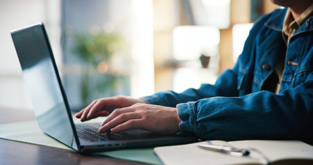 Business person, hands and typing on laptop in office for editing draft, publication and research....