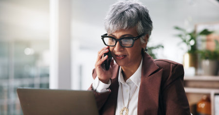 Business, phone call and woman with laptop, planning and schedule for tax audit, broker and accounting. Mature person, financial agency and investment with PC, portfolio management and discussionの写真素材
