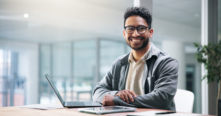 Laptop, portrait and smile with business man in office for administration, planning or report....