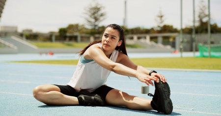 Runner, woman or stretching legs on race track for health, wellness or exercise preparation outdoor....