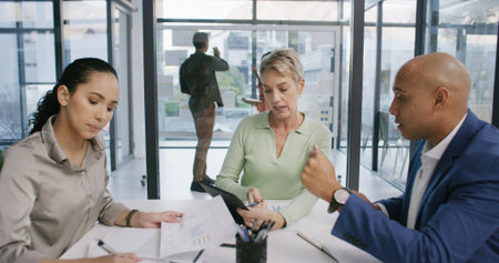 Group, people and meeting with document in office for finance graphs, profit growth and statistics. Staff, tablet and team with paperwork for accounting data, dividend report and financial proposalの写真素材