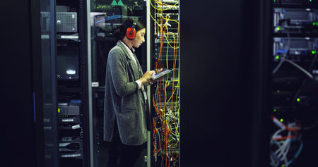 Cybersecurity, testing and woman on tablet for inspection, repair and maintenance in server room....