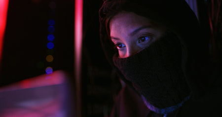 Night, hacker and person with mask for coding scam, phishing or cybercrime for online attack....