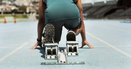 Running, start and block with man on race track for fitness, competition practice and workout....