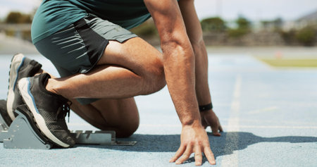 Running, ready and legs of man on race track for fitness, competition practice and workout. Begin,...
