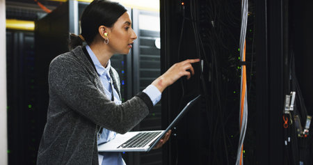 Cybersecurity, cable or woman on laptop for server room, repair or wires inspection. Information...