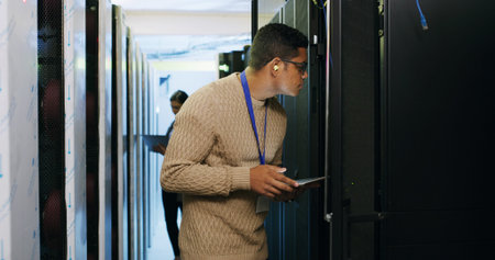 Inspection, maintenance and tablet with IT professional in server room for cybersecurity support....
