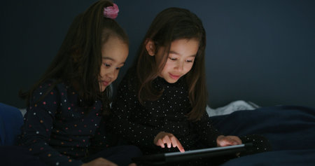 Relax, tablet and children in bedroom for show, film or video on app for entertainment together....