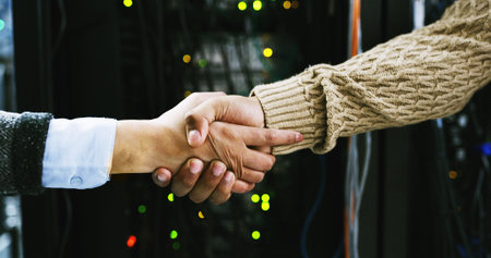 Business people, handshake and deal with agreement in server room for IT service or partnership....