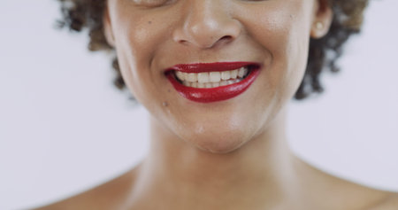 Lipstick, happy and mouth of woman in studio for red glow, beauty products and cosmetics. Smile,...