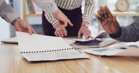 Hands, team and people with documents, office or financial analyst with data, discussion and budget. Accountant, analysis and group with paperwork for business development, meeting or plan with statsの写真素材