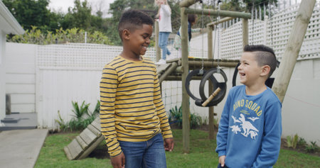 Happy, friends and boys at playground in backyard for having fun, bonding and playing together....