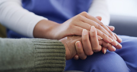 Holding hands, nurse and support for patient in nursing home, together or compassion for healthcare....