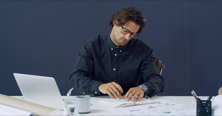 Notebook, business man and architect in office for schedule, checklist or design. Engineering,...