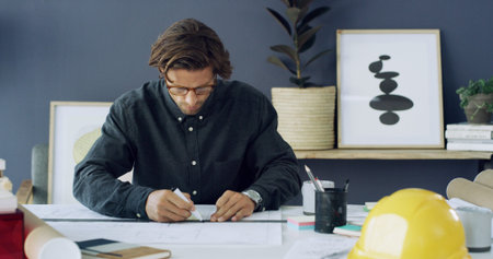 Drawing, man and architect with blueprints and stationery in office for construction planning with...