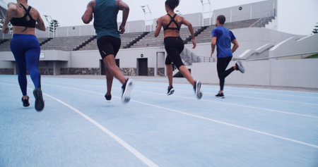 Running, competition and fitness with people on race track for workout, challenge and marathon....