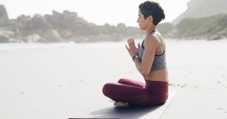Meditation, zen and prayer hands with woman at beach for mindfulness, namaste and health. Peace,...