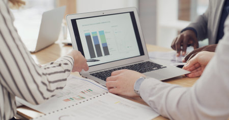 Laptop screen, teamwork and hands of business people in meeting for sales graph, revenue stats and research. Planning, data analysis and growth with employees in office for brainstorming and proposalの写真素材