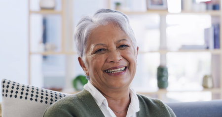 Portrait, senior woman and relax at house with smile, calm morning and weekend break in lounge....