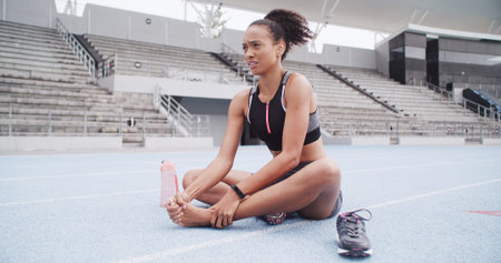 Exercise, foot injury and massage with woman in stadium for accident or physical emergency. Fitness,...