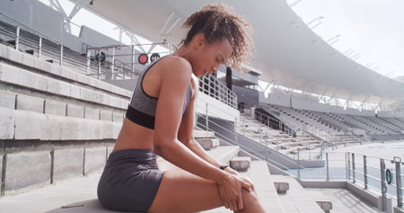 Fitness, knee pain and woman with injury at stadium, sports accident and fibromyalgia. Runner, race...
