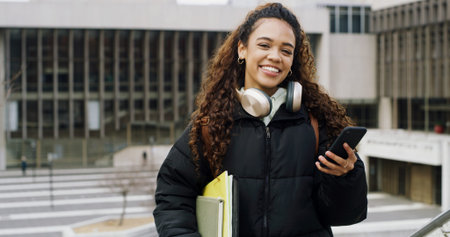 Student, portrait and woman with phone on campus with headphones for music, chat or academic online...