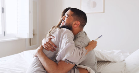 Pregnancy test, hug and love with couple in bed for ovulation prediction, celebration and good news....
