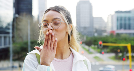 Confident, woman and blow kiss as student in city for education, urban learning and flirty pose....
