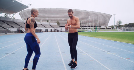Fitness, team and check watch on track for running speed, health stats and training performance....