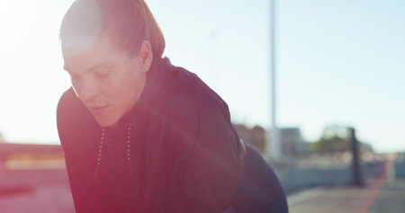 Athlete, tired and woman with rest in city for running recovery, exercise fatigue or overworked....