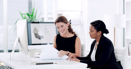 Research, teamwork and documents with business women in office for reading, insurance review and feedback. Client application, risk assessment report and collaboration with employees for paperworkの写真素材