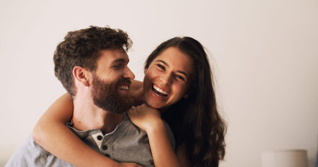 Love, hug and couple with laughing in home for funny conversation, bonding together and security....