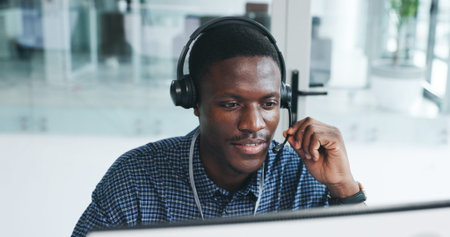 Black man, reading and computer with mic at call centre for customer service, client inquiry and...