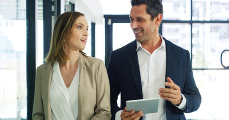 Business, teamwork and people with tablet, talking and financial agency with budget report. Employees, accounting and consultant in office, fintech or economy expert with connection or company profitの写真素材