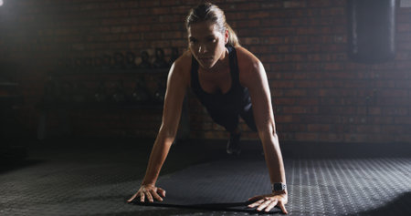 Thinking, woman and pushup for fitness at gym with exercise, strength training and workout. Female...