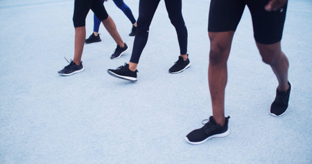 Active, people and running on road, legs or training for marathon together, race or workout routine....