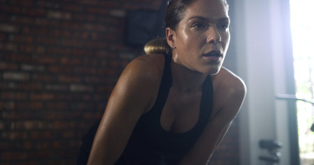 Fitness, tried and woman with breathing at gym for intense workout, exercise fatigue and sweating....